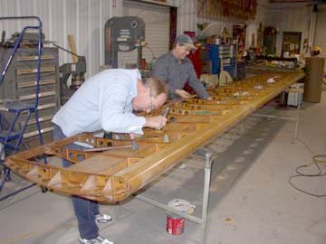Ted Dawson and Terry Bledsoe install top wing fittings