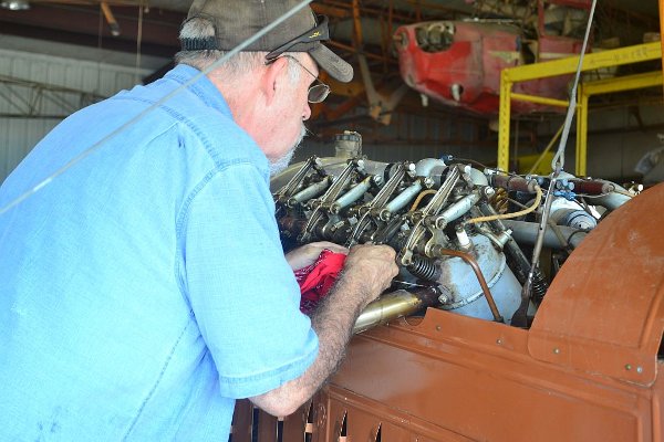 Working on the Canuck's Curtiss OX-5 engine