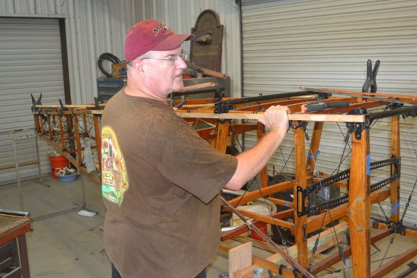 Dave Miller fitting rub strips to the Thomas-Morse longerons