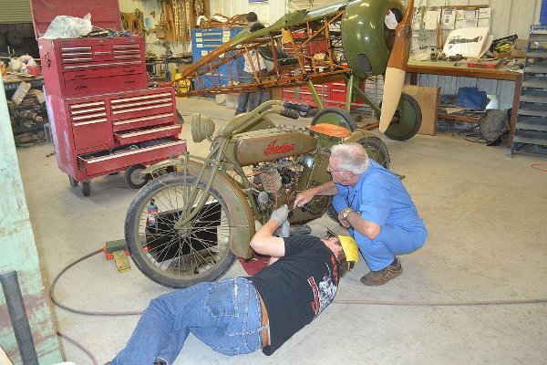 Working on the Indian motorcycle